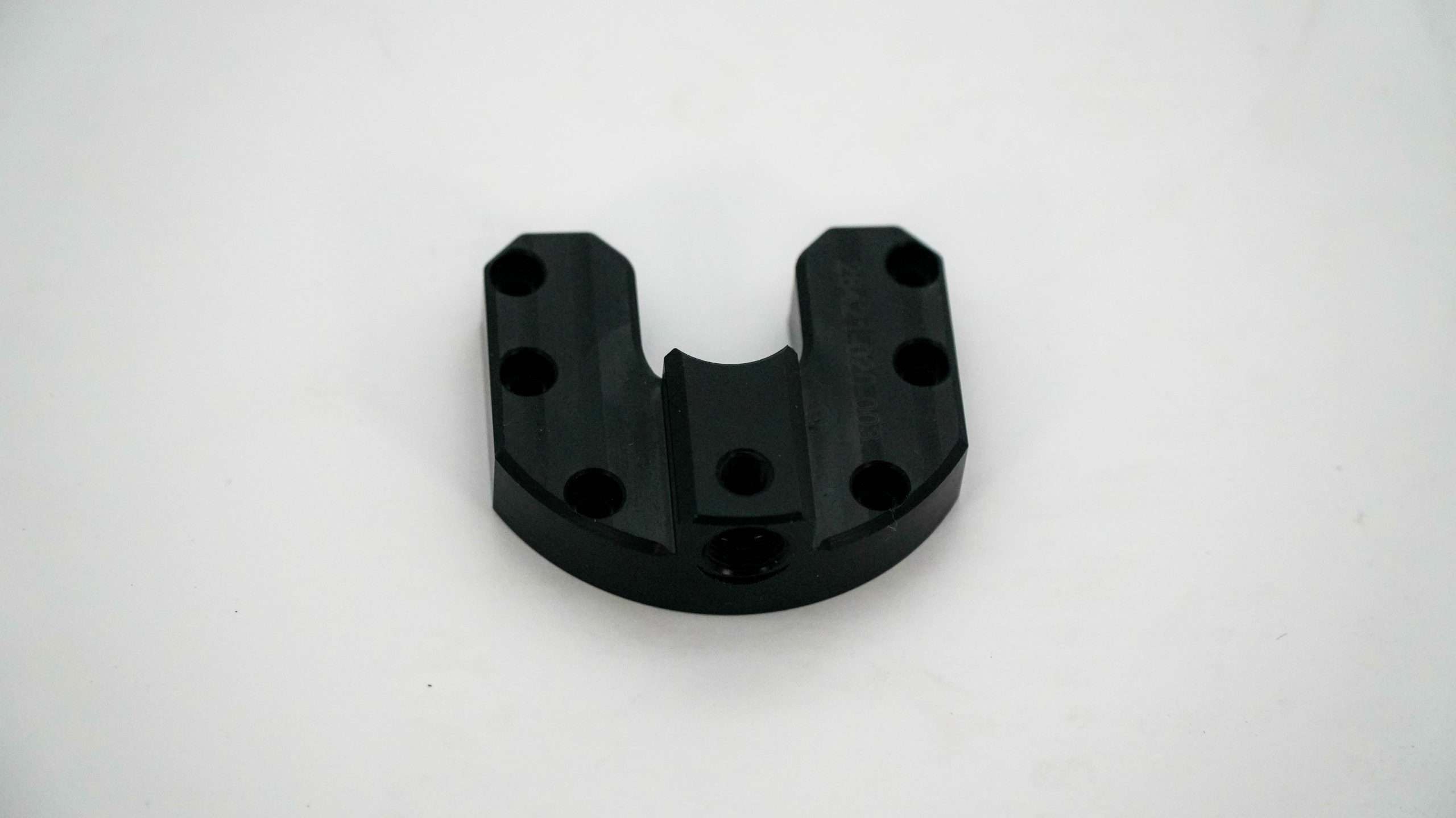 Black finished machined bracket