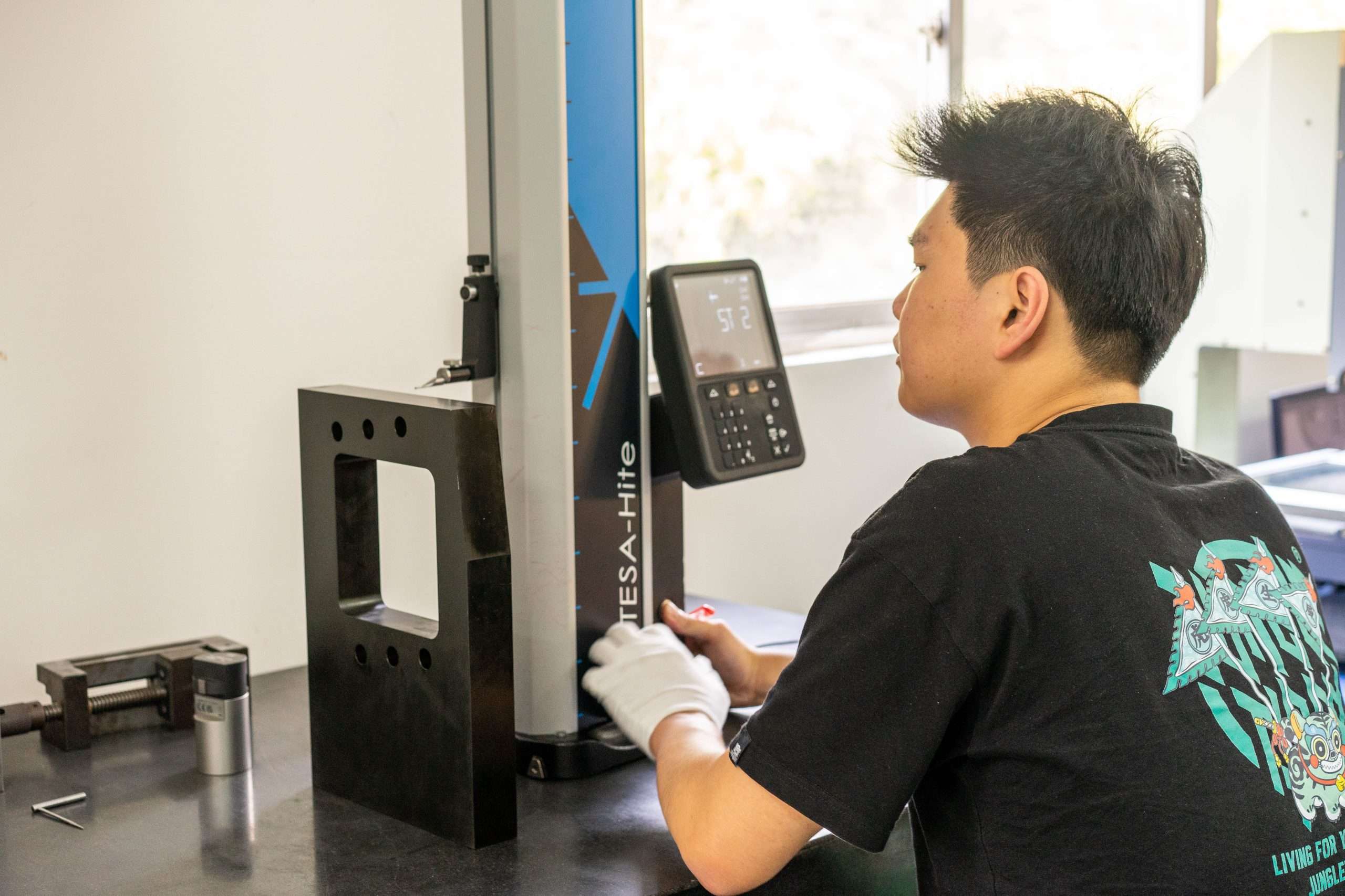 Team member using height measurement equipment