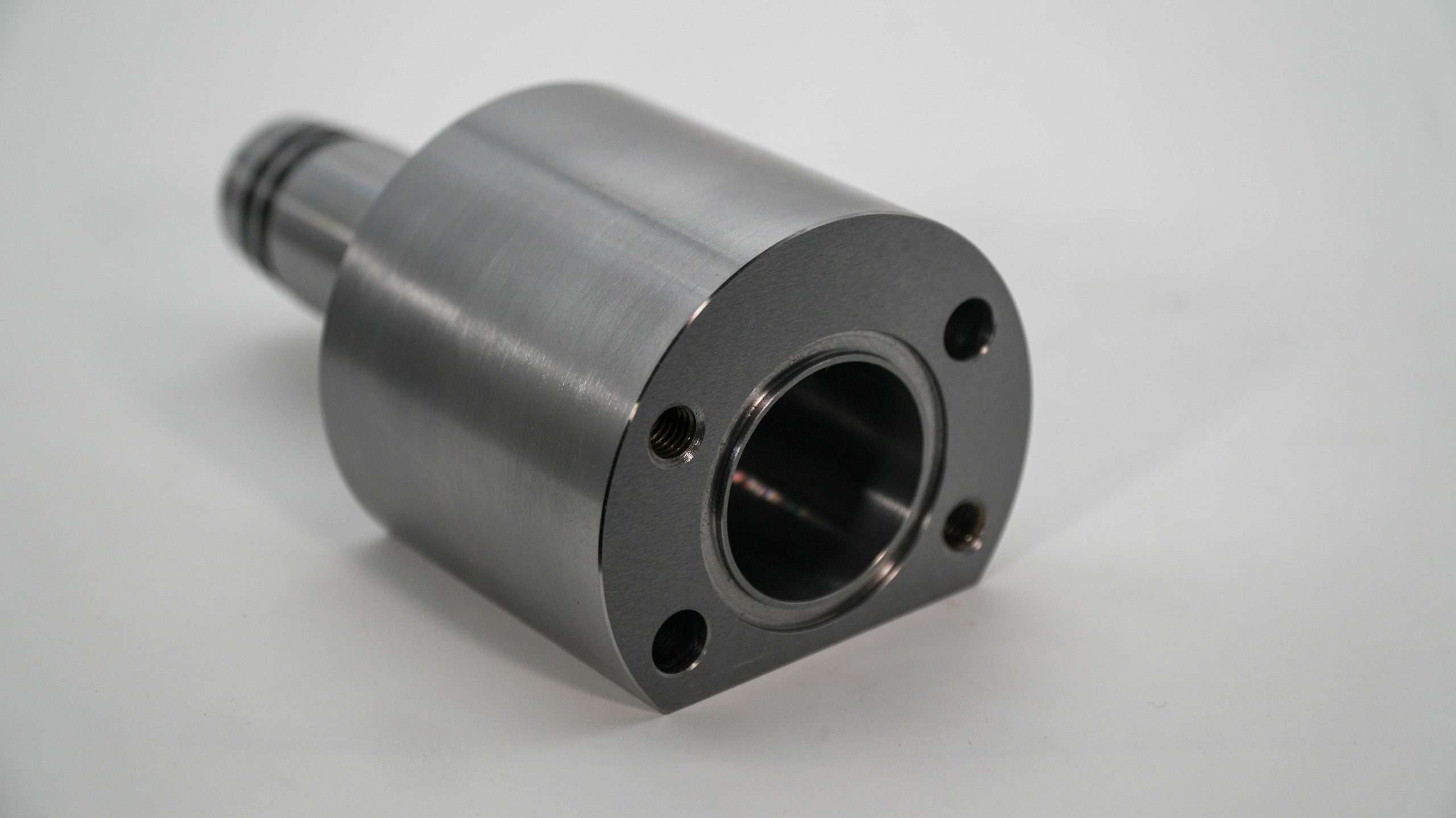 Machined cylindrical housing